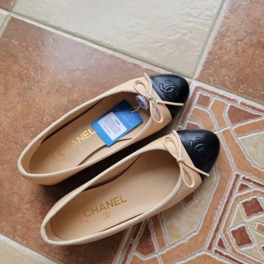 CHANEL Tan and Black Flats with Bow Accent
